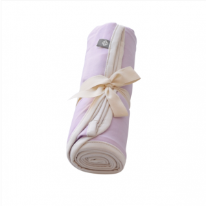 Kyte Baby swaddling blanket in mauve with cloud trim